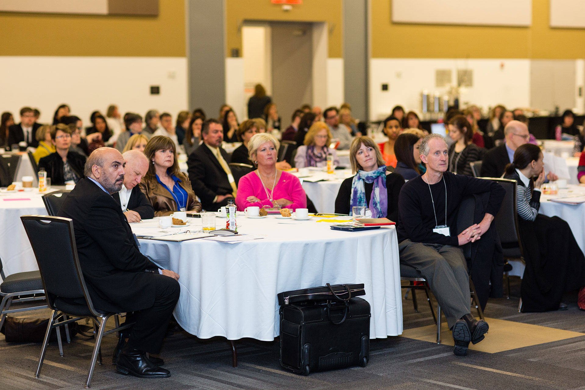 Room of participants of CALS sitting at tables