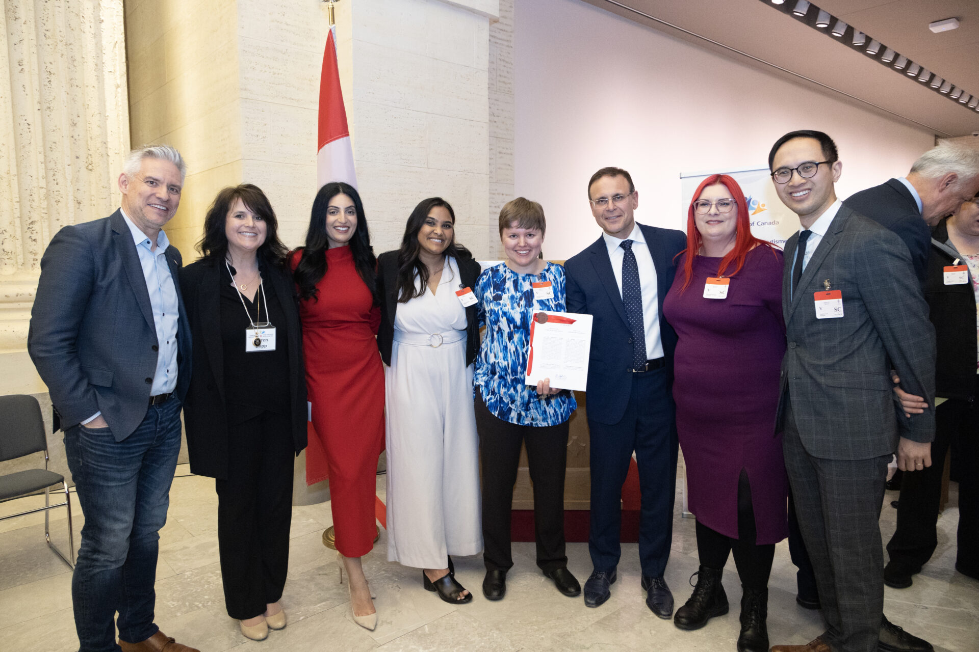 Autism Alliance of Canada board members and staff being photographed with Canadian politicians.