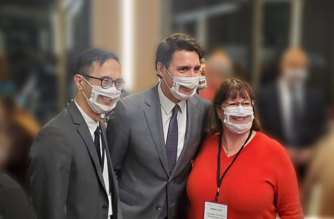 Dr. Jonathan Lai being photographed with Debbie Irish and Prime Minister Justin Trudeau