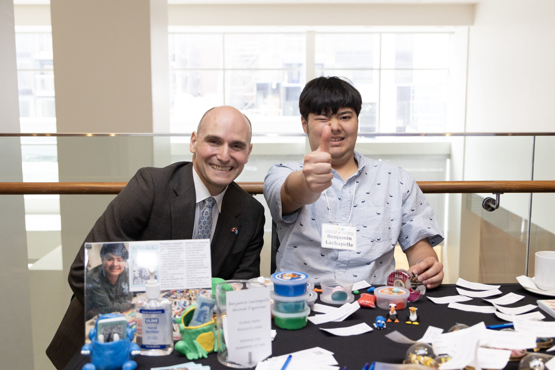 The Hon. Minister Jean-Yves Duclos with Benjamin Lachapelle, Autistic Author and Artist