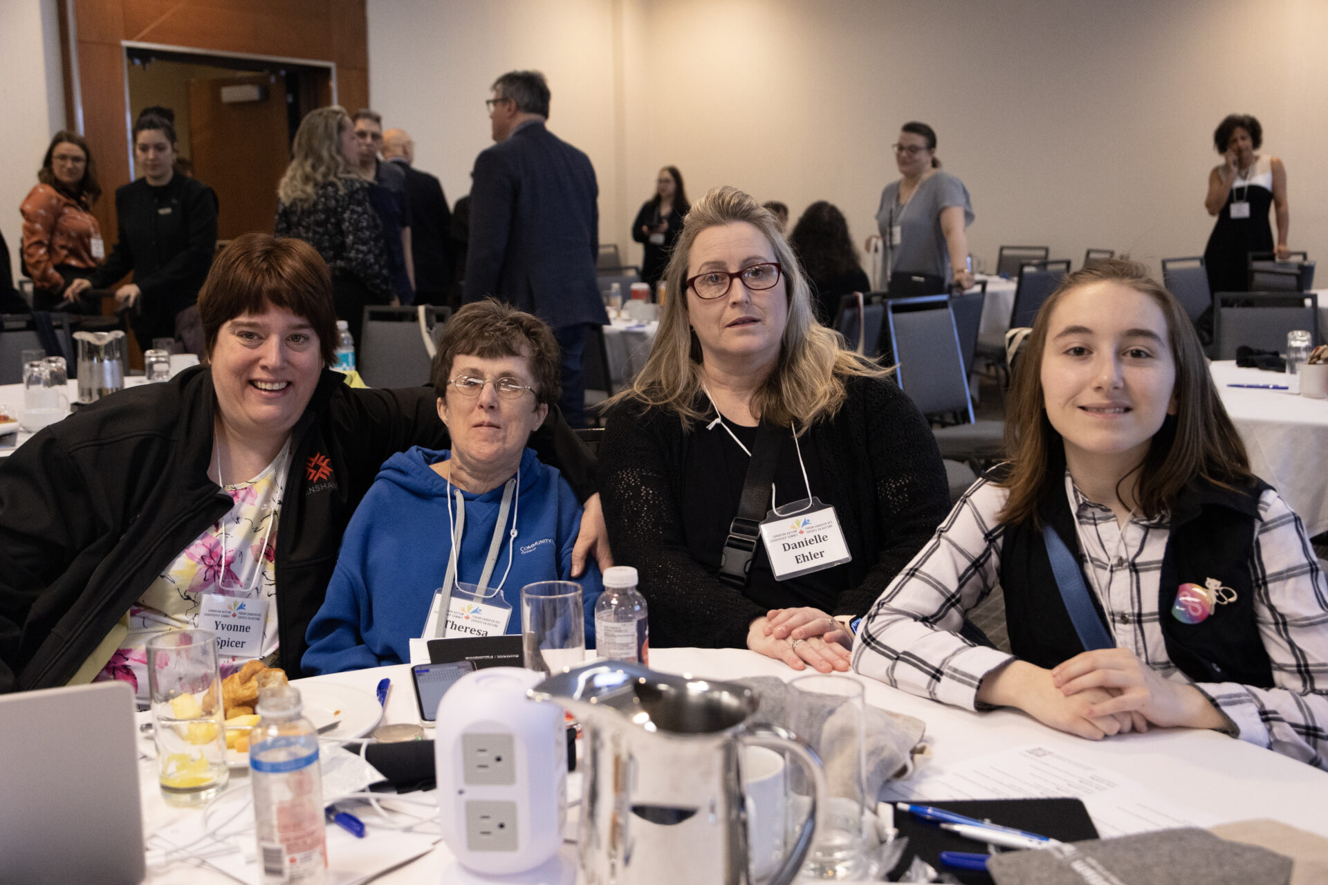 Four female participants of different ages sitting together at a CALS event.